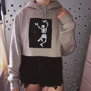 tan cropped hoodie w a painted skeleton